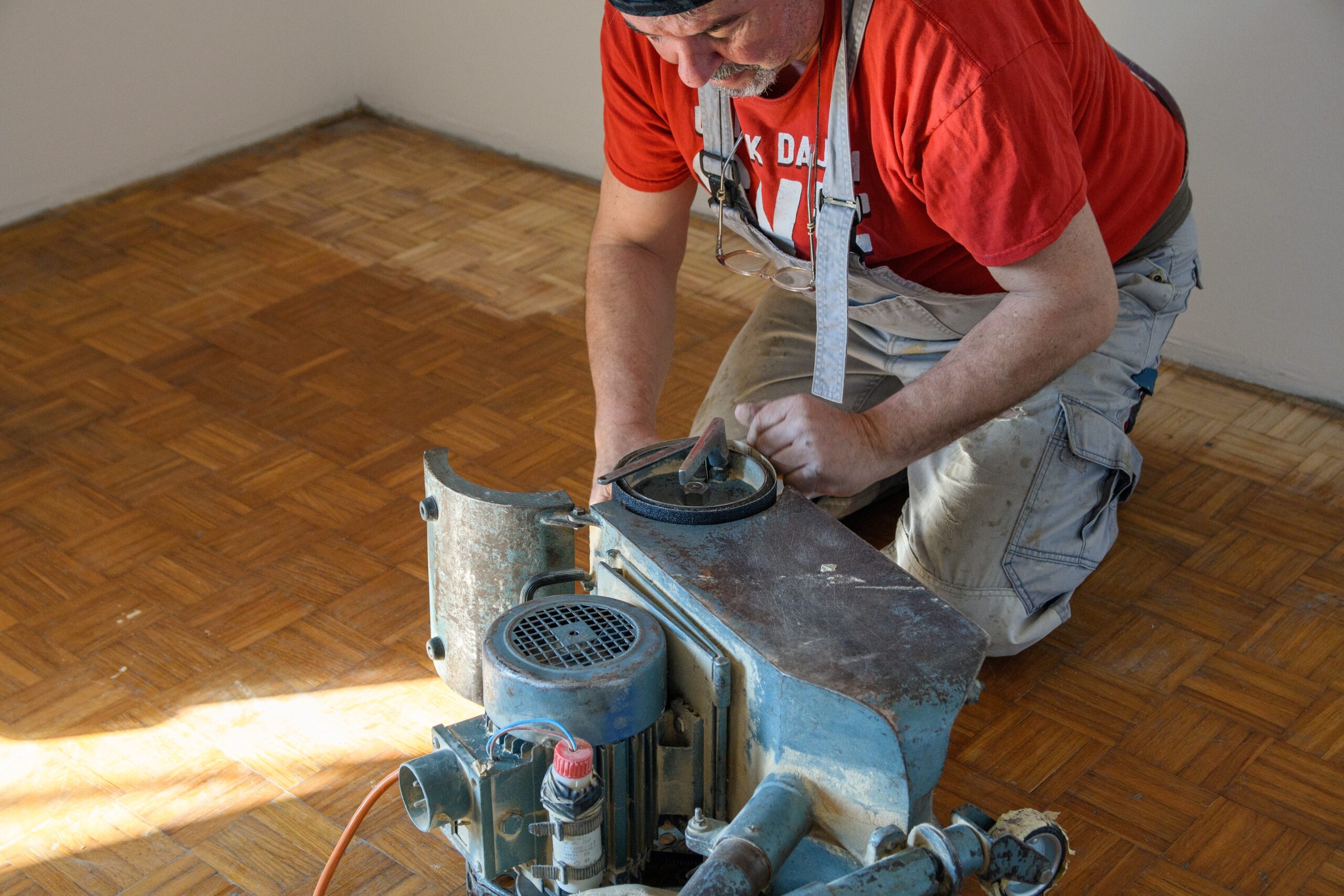 man-changing-sanding-paper-on-grinding-machine-for-2025-03-06-07-00-04-utc